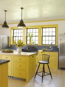 . Bright Yellow Kitchen Including Soapstone and Butcher Block Countertops 