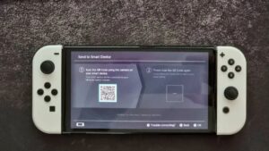 When prompted, the Switch will display a QR code, scan it with your smartphone camera, and connect to the Wi-Fi hotspot